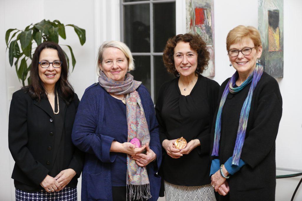 University of Rochester President Sarah Mangelsdorf is posing with three Presidential Diversity Award recipients.