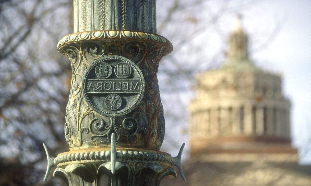 photo of Meliora flagpole and Rush Rhees tower